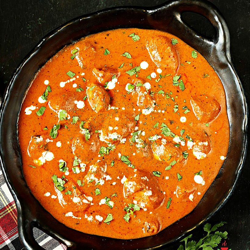 Butter chicken in a copper pan